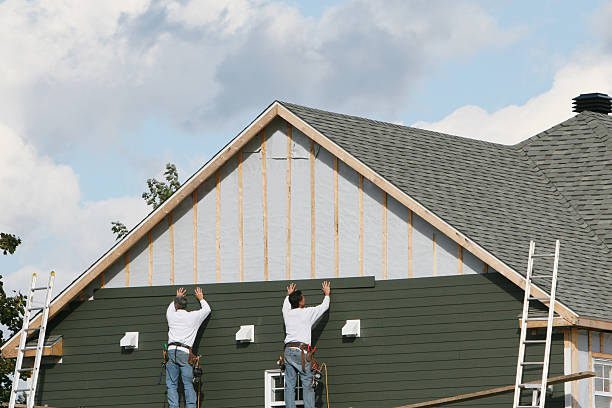 Professional Siding Replacement technician working in Warfield, VA